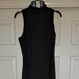 Simply Stated Long Black Dress Complete with Buttons and a Bow on the Back.